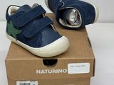 baby boy ' s shoes in a box on a white surface