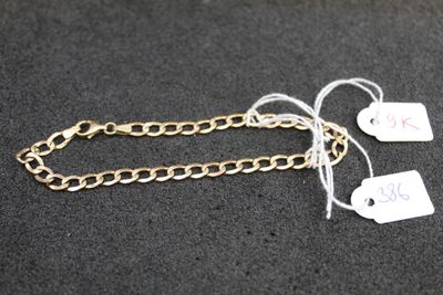 a close up of two tags attached to a chain on a table