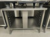 a stainless steel counter top with drawers on it in a kitchen