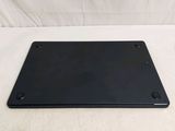 a black plate on a white table with a white background