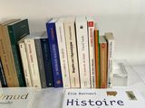 many books that are sitting on a table
