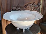 a large white bowl sitting on top of a table