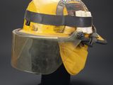 a close up of a helmet with a visor on a stand