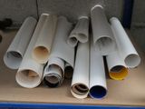 many rolls of paper sitting on a table next to each other