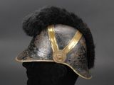 an old helmet with fur on top of it on a mannequin head