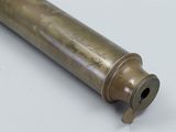 a close up of an old brass telescope on a white surface