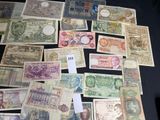many different types of paper money on the table