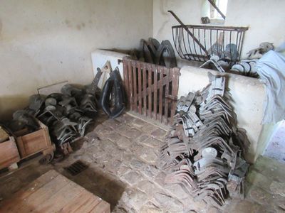 a room that has a lot of chairs and a basket on the floor