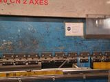 a picture of a machine that is working on a piece of metal