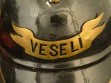 a close up of a helmet with a gold emblem on it