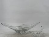 two clear glass bowls sitting on top of a white surface