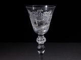 a wine glass that is sitting on a table