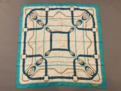 an image of a blue and white scarf with chains