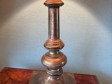 a lamp that is on top of a wooden table