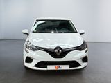 the front view of a white car parked in a showroom