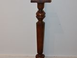 a small wooden table with a wooden top on the floor