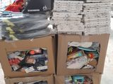 a cart full of boxes with items on top of it