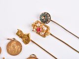 many different types of jewelry on a white surface