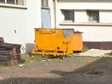 a dump truck that is parked in front of a building