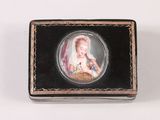 a small black box with a picture of a woman on it