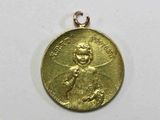 une image représentant une médaille d'or sur laquelle figure le portrait d'un homme