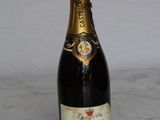 a bottle of champagne sitting on a table