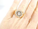 an image of a woman ' s hand with a diamond ring on it