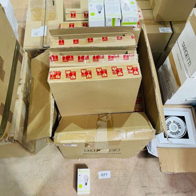 many boxes and boxes of electronic devices on the floor