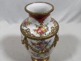 a vase that is sitting on a white surface