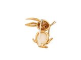 a close up of a bird broochle on a white background