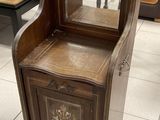 a wooden cabinet with a mirror on top of it