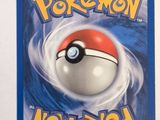 a close up of a pokemon card on a white surface
