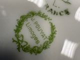 a white plate with a green design on it