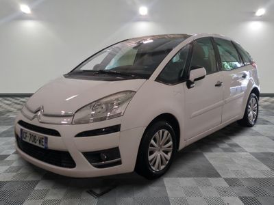 a picture of a white citrole parked on a checkered floor
