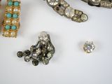 many different types of jewelry on a table