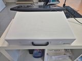 a white box sitting on top of a white table