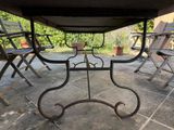 a table and chairs that are outside on the patio