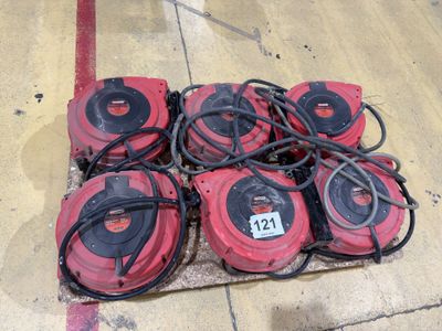several red and black vacuum cleaners sitting on top of a wooden pallet