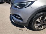 a close up of a car parked in a parking lot
