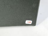 a black box with a red and white sticker on it