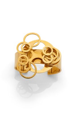 a close up of a gold ring on a white surface