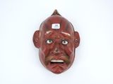 an image of a red mask on a white background