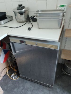 an image of a small kitchen with a dishwasher and a stove