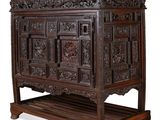 an image of a wooden cabinet with carvings on it