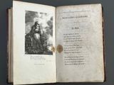 an open book with a picture of a woman sitting on top of it