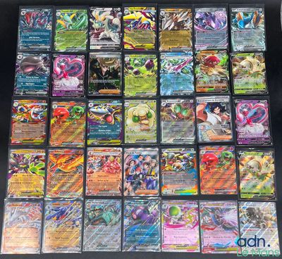 a close up of a bunch of pokemon cards on a table