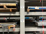 a large rack of metal items in a warehouse