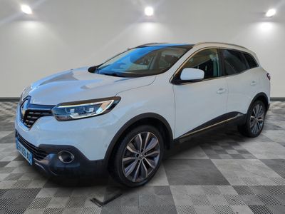 a white renault kad suv parked on a checkered floor