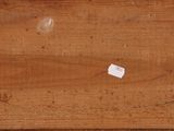 a piece of wood that has a piece of paper on it