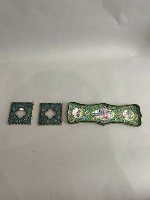 two pieces of green and white porcelain with a green and white design